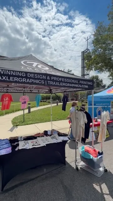 Traxler Graphics pop-up tent and apparel racks at the Upper Arlington farmers market